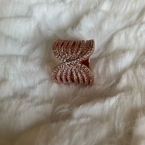 Rose gold ring with stones.